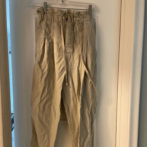 Free People paper bag pants. Small stain on leg. Price is reflected. - Picture 1 of 3